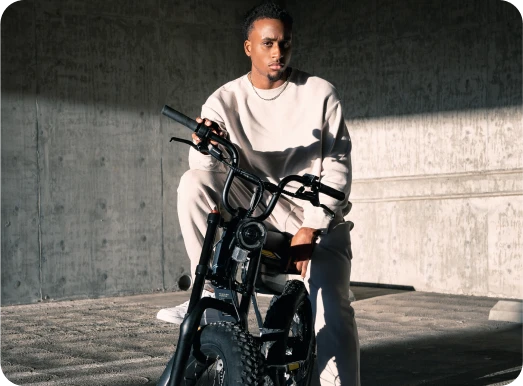 A man is sitting on his VinFast electric bike ready to go for a ride