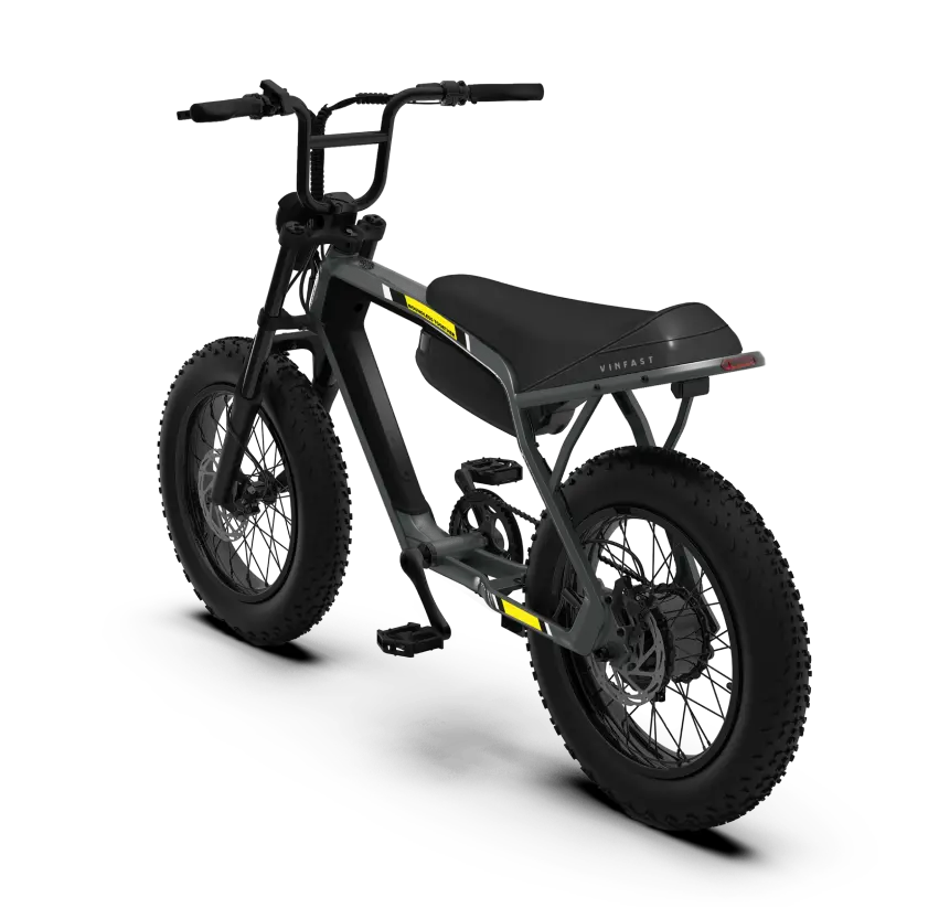 The VinFast electric bike features a cushioned saddle, a handlebar-mounted display, and a sleek design